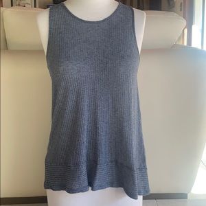 Loose grey/blue tunic top with back button detail.